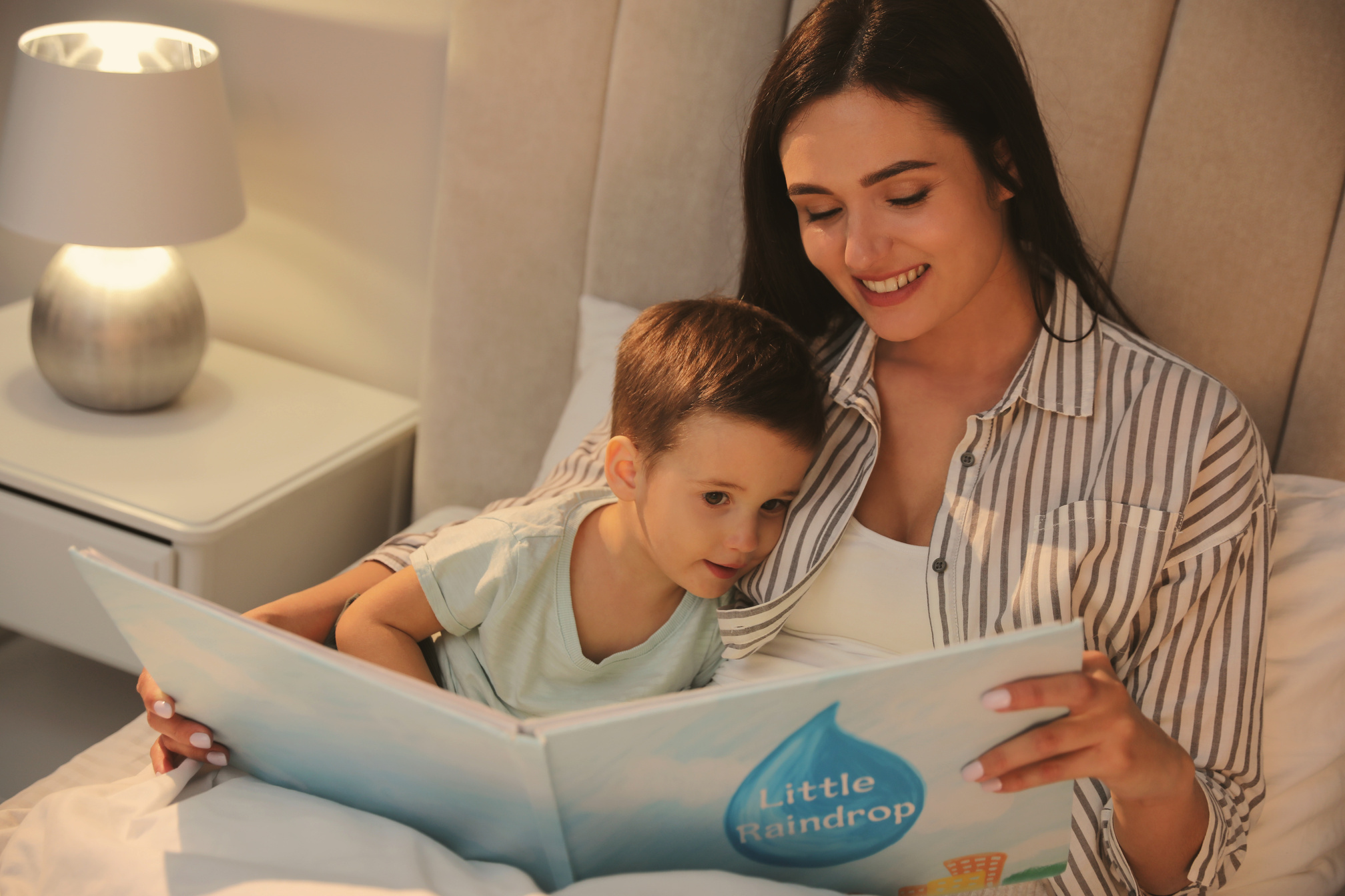 Parent Reading Bedtime Story to Child at Home